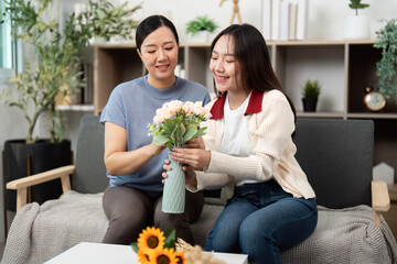 Creating Beautiful Flower Bouquets Together. Mother and Daughter Sharing a Crafting Moment.