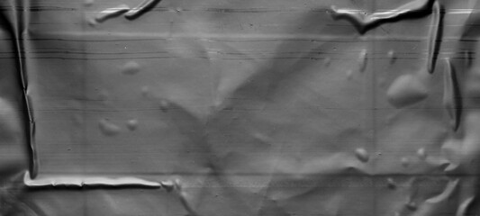 black crumpled and creased plastic bag texture background
