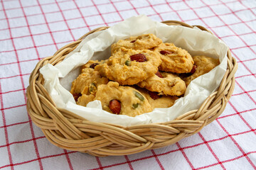 Homemade Healthy Cereal Cookies with almond top in container woven