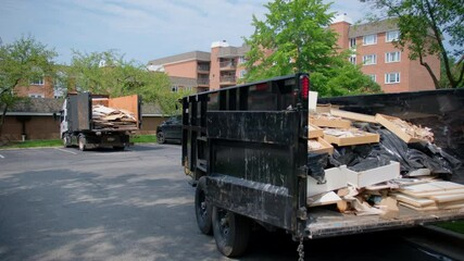 View of two trucks full of garbage from construction site. Loaded truck view from inside