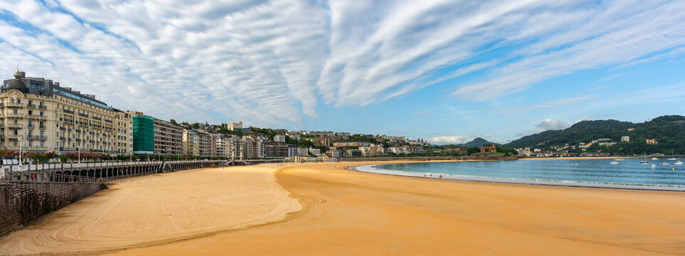 Great panoramic view of La Concha beach at dawn on a summer's day, San Sebastian.