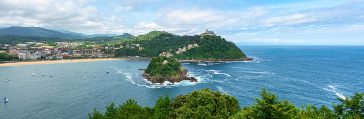 Great panoramic aerial view of La Concha Bay with Santa Clara Island and Mount Igueldo in the background, San Sebastian, Basque Country
