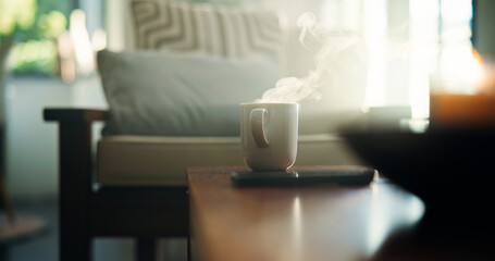 Home, cup and coffee on table, steam and morning with hot beverage, lens flare and smoke. Empty,...