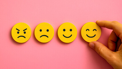 Minimalist wooden circle icons with pink backdrop and selected smile expression, visualizing cheerful response, satisfaction, and happiness in rating or communication concept