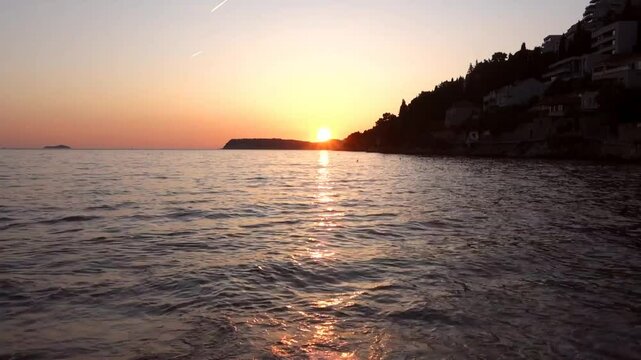 Timelapse, Spring sunset at Uvala Lapad beach in Dubrovnik, Croatian coastline