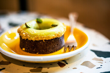 dessert Dubai tart with pistachio cream on a yellow plate, with Good morning