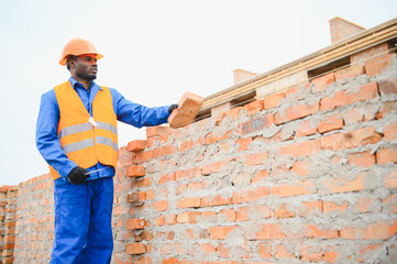African american Construction worker in uniform and safety equipment have job on building....