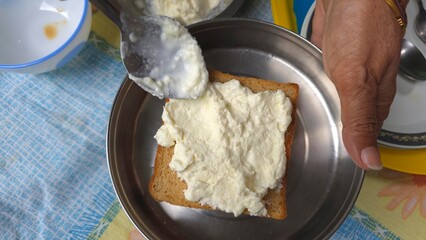 Trending Dubai malai chai dish making, trending viral on internet food. Wheat bread and creamy milk malai spread, homemade for viral instagram food item, Malai tea bread