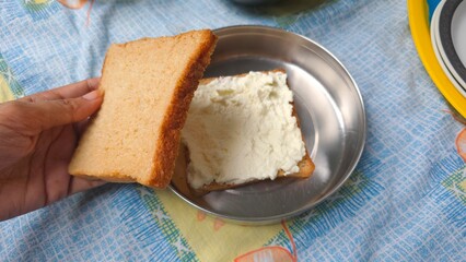 Trending Dubai malai chai dish making, trending viral on internet food. Wheat bread and creamy milk malai spread, homemade for viral instagram food item, Malai tea bread