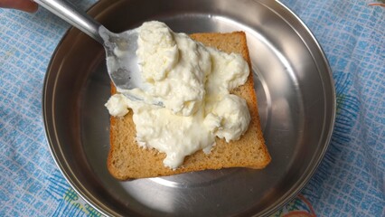 Trending Dubai malai chai dish making, trending viral on internet food. Wheat bread and creamy milk malai spread, homemade for viral instagram food item, Malai tea bread