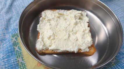 Trending Dubai malai chai dish making, trending viral on internet food. Wheat bread and creamy milk malai spread, homemade for viral instagram food item, Malai tea bread