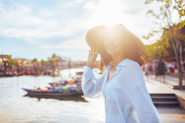 Smiling Woman In Vietnamese Hat In Backlight By River In Hoi An Vietnam