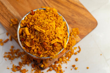 Bombay mix is a spicy Indian snack made from fried lentils, peanuts, chickpea flour noodles, and spices, offering a crunchy, flavorful treat.
