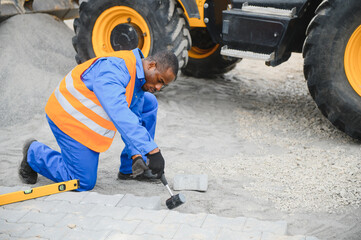 Pavement. Laying paving stones. Cube, openwork plate