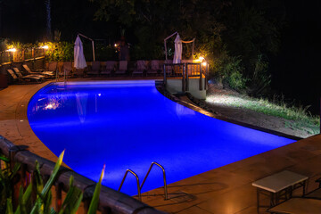 swimming pool in the hotel at night