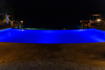 swimming pool in the hotel at night