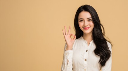 Smiling Woman Showing OK Gesture

