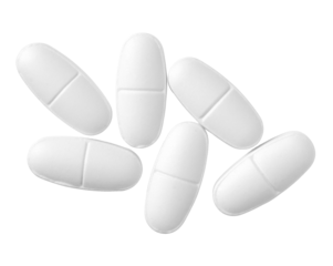 White oval pills isolated on white background, top view.