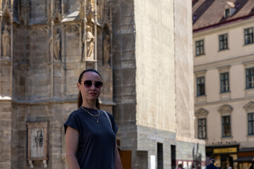 Fototapeta premium Female tourist walks in a historical city and sees the sights. Austria, Vienna