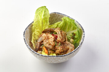 Spicy shrimp salad with fresh herbs and crisp lettuce in ceramic bowl, featuring vibrant mix of flavors and textures, perfect for refreshing and zesty meal