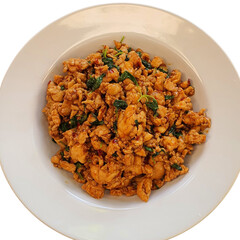 Deliciously Spicy Stir-fried Chicken with Holy Basil on a White Plate