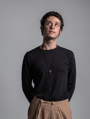 Vertical studio portrait of curly-haired boy