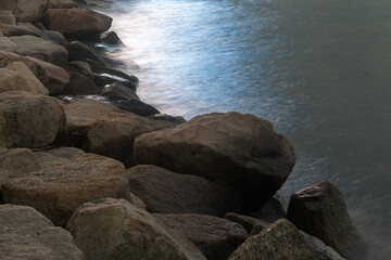A photo of a lake shore taken at dusk.