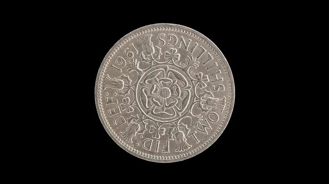 United Kingdom 1961 two shillings coin reverse with Tudor rose rotating on black background