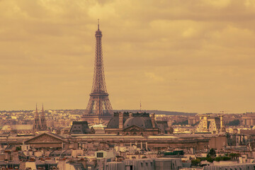 retro style photo of Eiffel tower and roofs of buildings in Paris