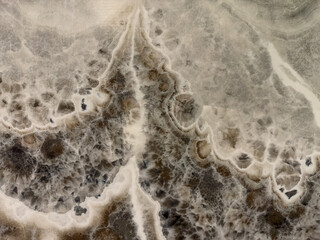 High-resolution marble texture with bold, organic patterns and subtle earthy colors, perfect for backgrounds and modern decor