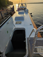 Boat hydrofoil with a ladder leading down to passenger saloon and to the water river. The boat is...