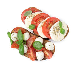 Tasty sandwiches with mozzarella cheese, tomatoes, basil and spices isolated on white, top view