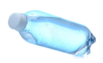 Plastic bottle with clean water in air on white background
