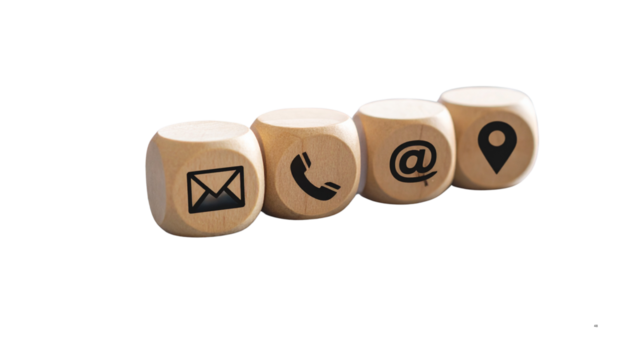 Customer Support Concept with Communication Icons on Wooden Cubes over Laptop Keyboard