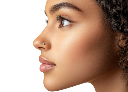 Close-Up Profile of a Young Woman with Beautiful Skin, Curly Hair, and Nose Piercing in a Studio Setting Against a Black Background