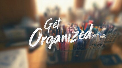 Encouraging text "Get Organized" overlaying a soft-focus office space, used for promoting time management and workflow tips.