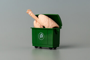 A model of human lungs inside a green trash bin. Lung disease, respiratory illness, the negative...