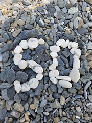 Rock formation that says 50 jubilee happy birthday . The rocks are all different sizes and shapes. The rocks are scattered all over the ground