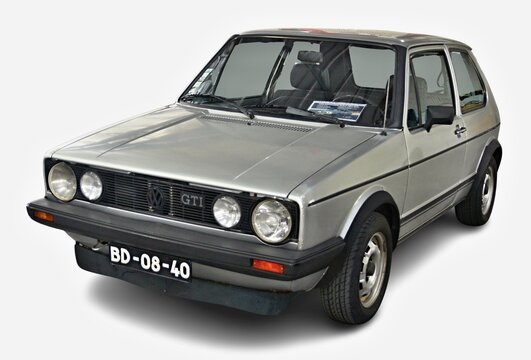 Silver Volkswagen Golf GTI Mk1 posing in studio
