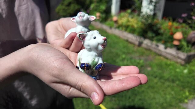 toy lamb. ram figurine. faience lamb figurine. glass toy. vintage figurine. Cute Easter lamb or sheep decoration in young spring grass and ivy,