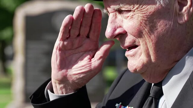 Elderly veteran saluting outdoors with respect and dignity, symbolizing honor and pride in service