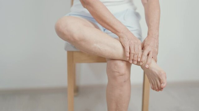 Elderly woman having leg pain due to Ankle Sprains or Achilles Tendonitis and Shin Splints ache. injury, hyperuricemia disease, Gout,Senior Health care and medical treatment  concepts