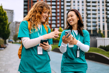 Healthcare workers enjoying outdoor break while discussing projects and sharing ideas on...