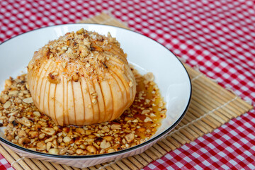 homemade santol with sweet spicy, is a tropical fruit grown in Southeast Asia. It has a sour taste. Thai style and delicious