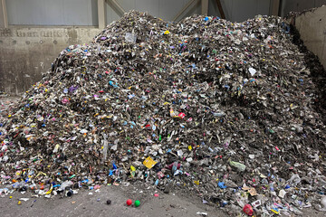 Falling trash mountain of garbage heap, landfill waste for compost. Conveyor belt waste drum filter...