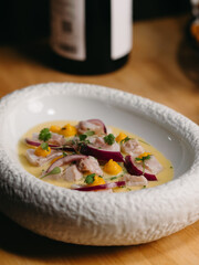 Salad in a white bowl on the table