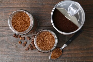 Instant coffee in jars and beans on wooden table, flat lay