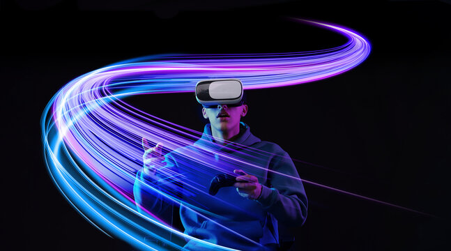 Man using virtual reality headset and controller against black background. Bright neon lines near him
