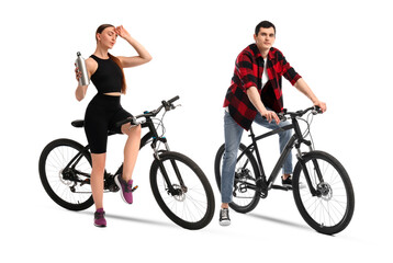 Young man and woman with bicycles on white background
