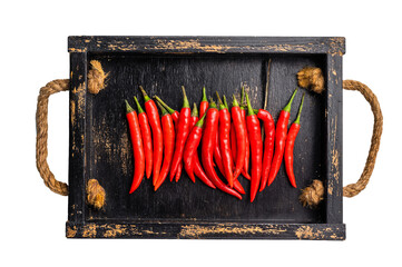 Red hot chili peppers on wooden board isolated on white background. top view